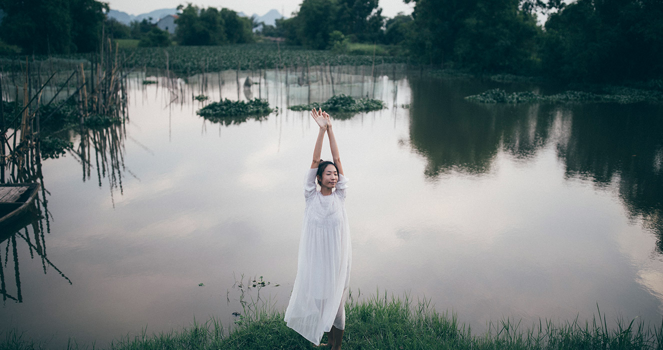 Trang modelling sweep dress in Ninh Bing, yoga pose