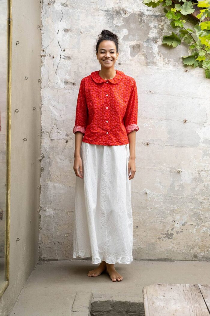 model wearing panelled skirt sula cotton panelled skirt and round collar shirt