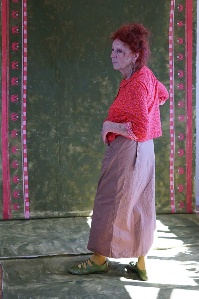 model wearing round collar shirt sula long sleeved flower print shirt and hope skirt