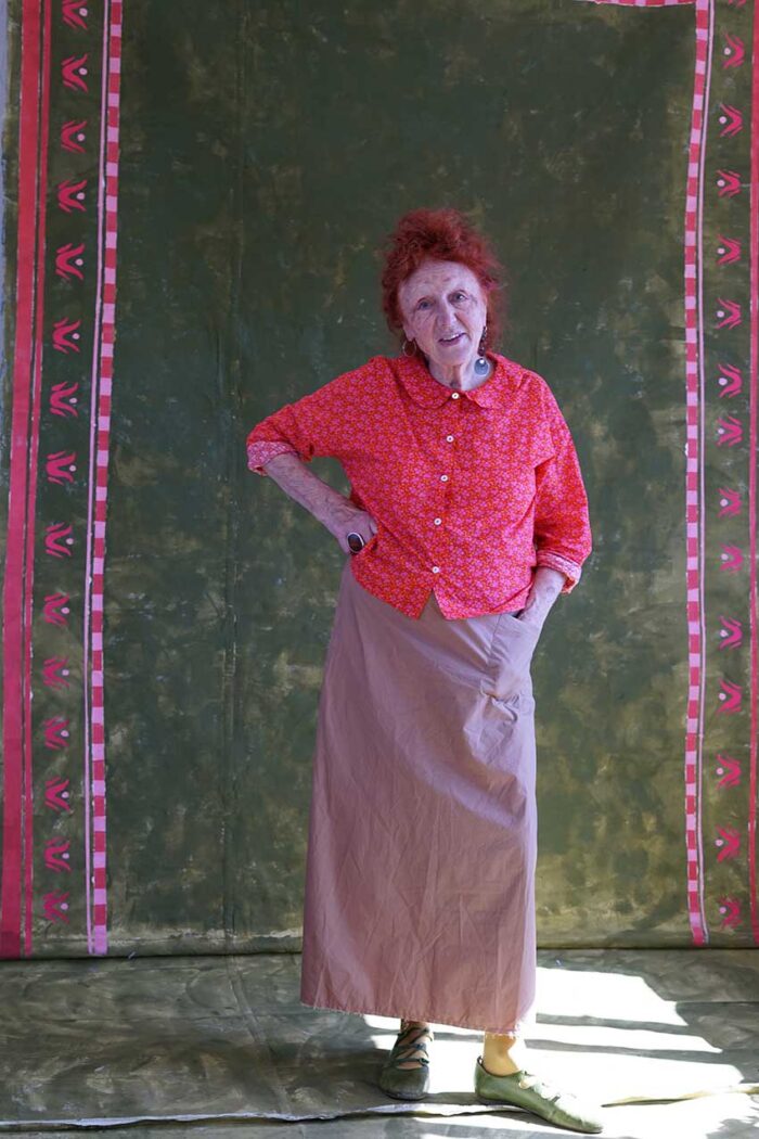 model wearing round collar shirt sula long sleeved flower print shirt and hope skirt