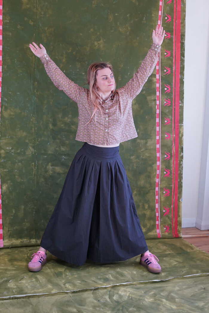 model wearing round collar shirt sula long sleeved flower print shirt and culottes