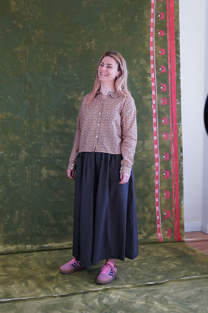 model wearing round collar shirt sula long sleeved flower print shirt and culottes