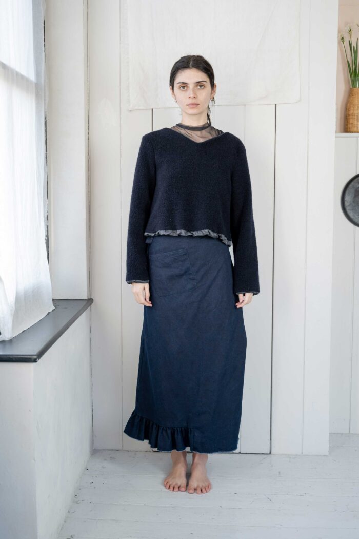 model wearing stornoway sweater sula Long sleeve fluffy sweater and daisy skirt