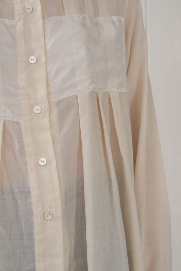 model wearing patchy blouse sula Panel and pleat blouse
