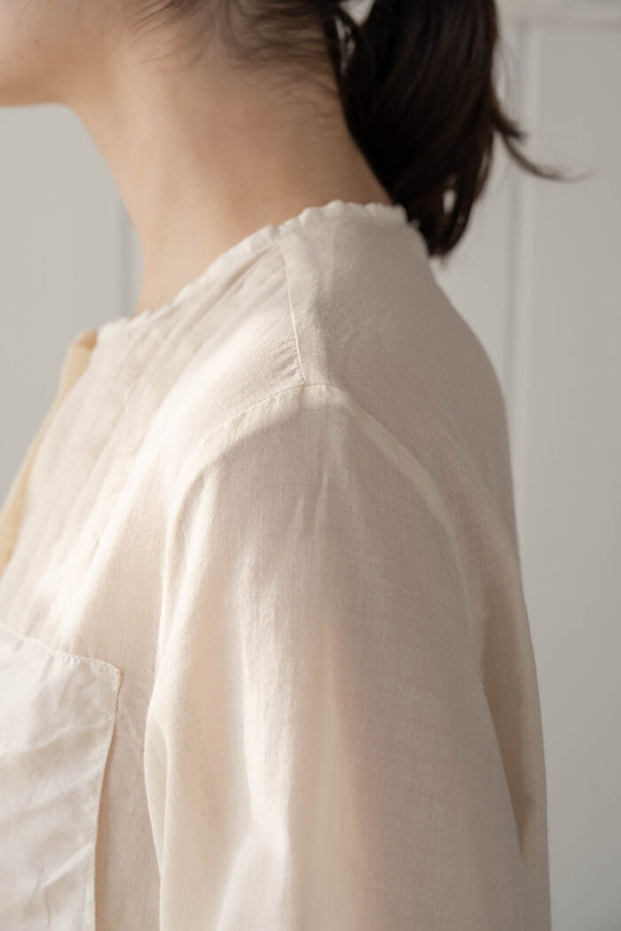 model wearing patchy blouse sula Panel and pleat blouse
