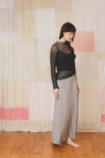 model wearing slash neck tee sula Silk tulle tee and bias cut skirt long
