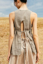 model wearing apron blouse sula Open back top with ties