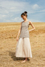 model wearing apron blouse sula Open back top with ties