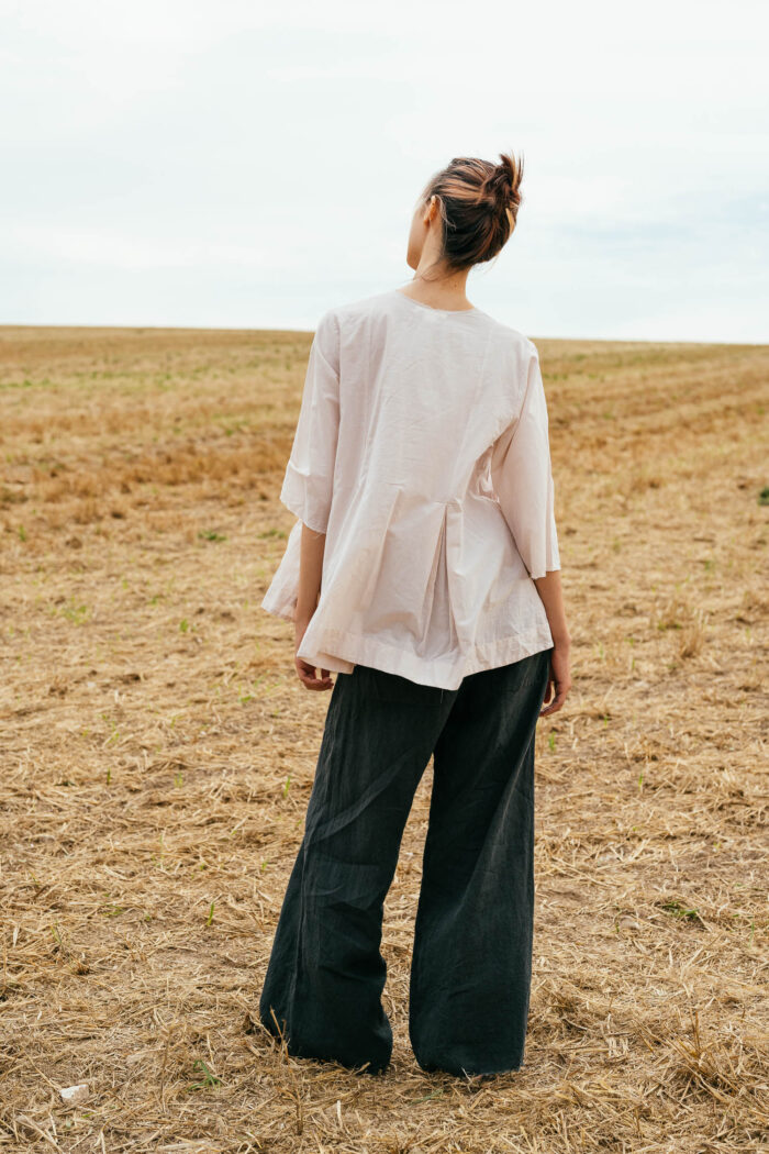 model wearing double pleat top sula Cotton top with pleats