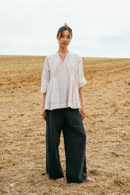 model wearing double pleat top sula Cotton top with pleats