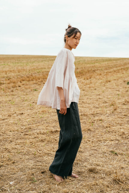 model wearing double pleat top sula Cotton top with pleats