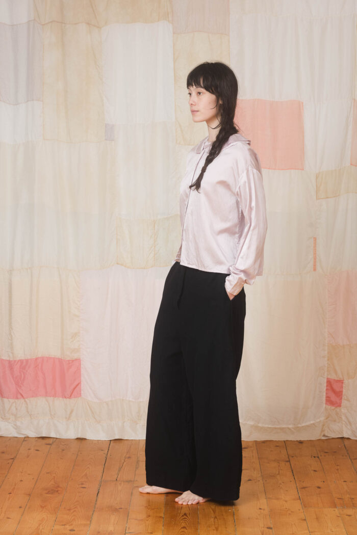 model wearing round collar shirt sula Satin round collar shirt and tailored pants