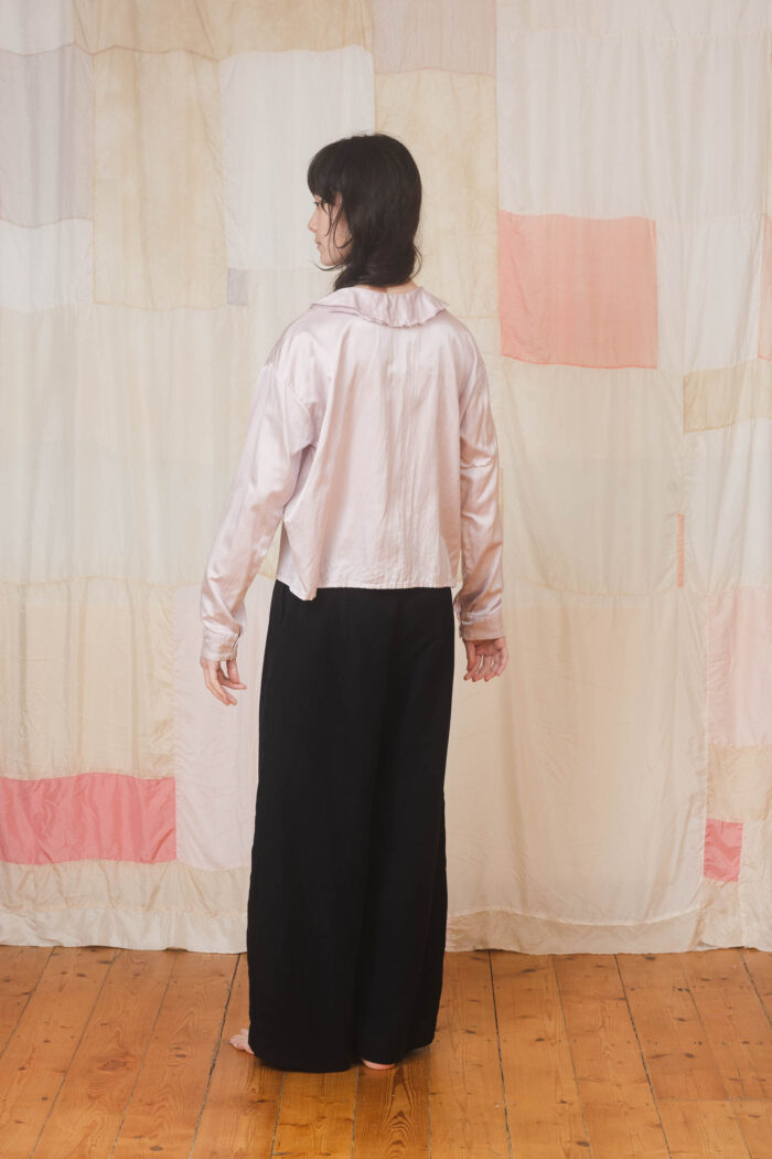 model wearing round collar shirt sula Satin round collar shirt and tailored pants