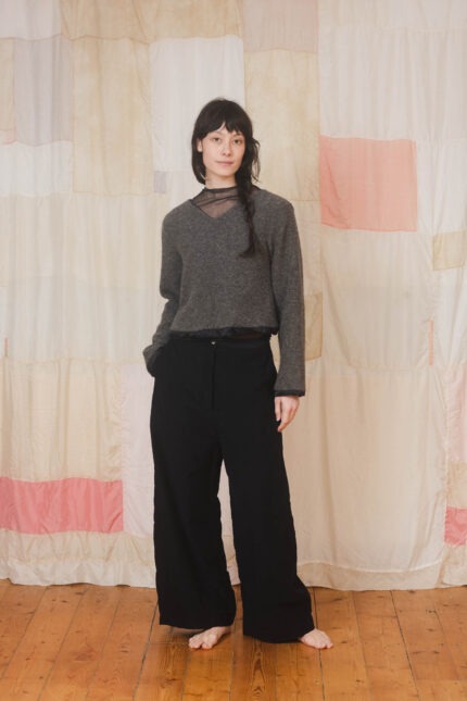 model wearing stornoway sweater sula Fluffy v-neck sweater and tailored pants