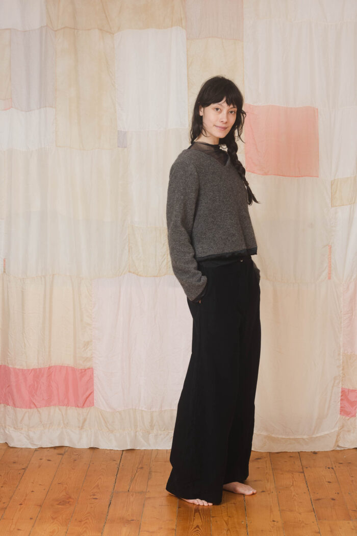 model wearing stornoway sweater sula Fluffy v-neck sweater and tailored pants