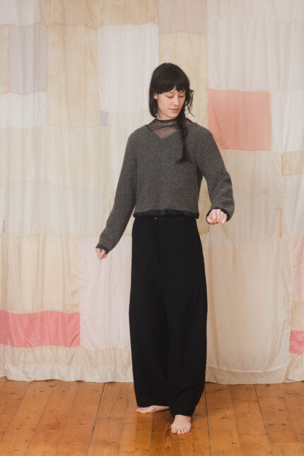 model wearing stornoway sweater sula Fluffy v-neck sweater and tailored pants