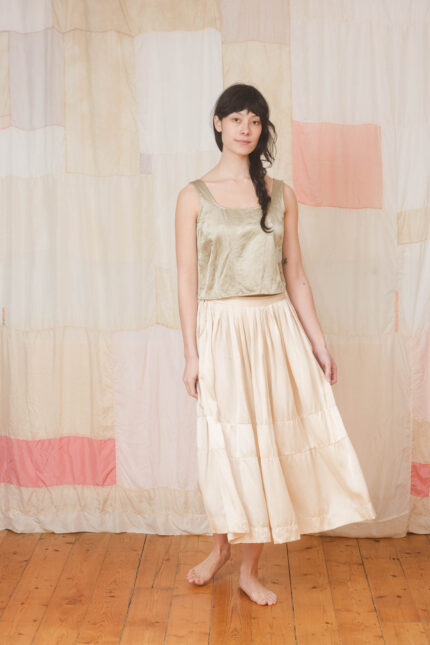 model wearing corset top sula Shiny panelled corset top and big satin skirt