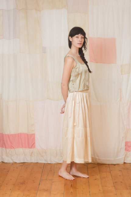 model wearing corset top sula Shiny panelled corset top and big satin skirt