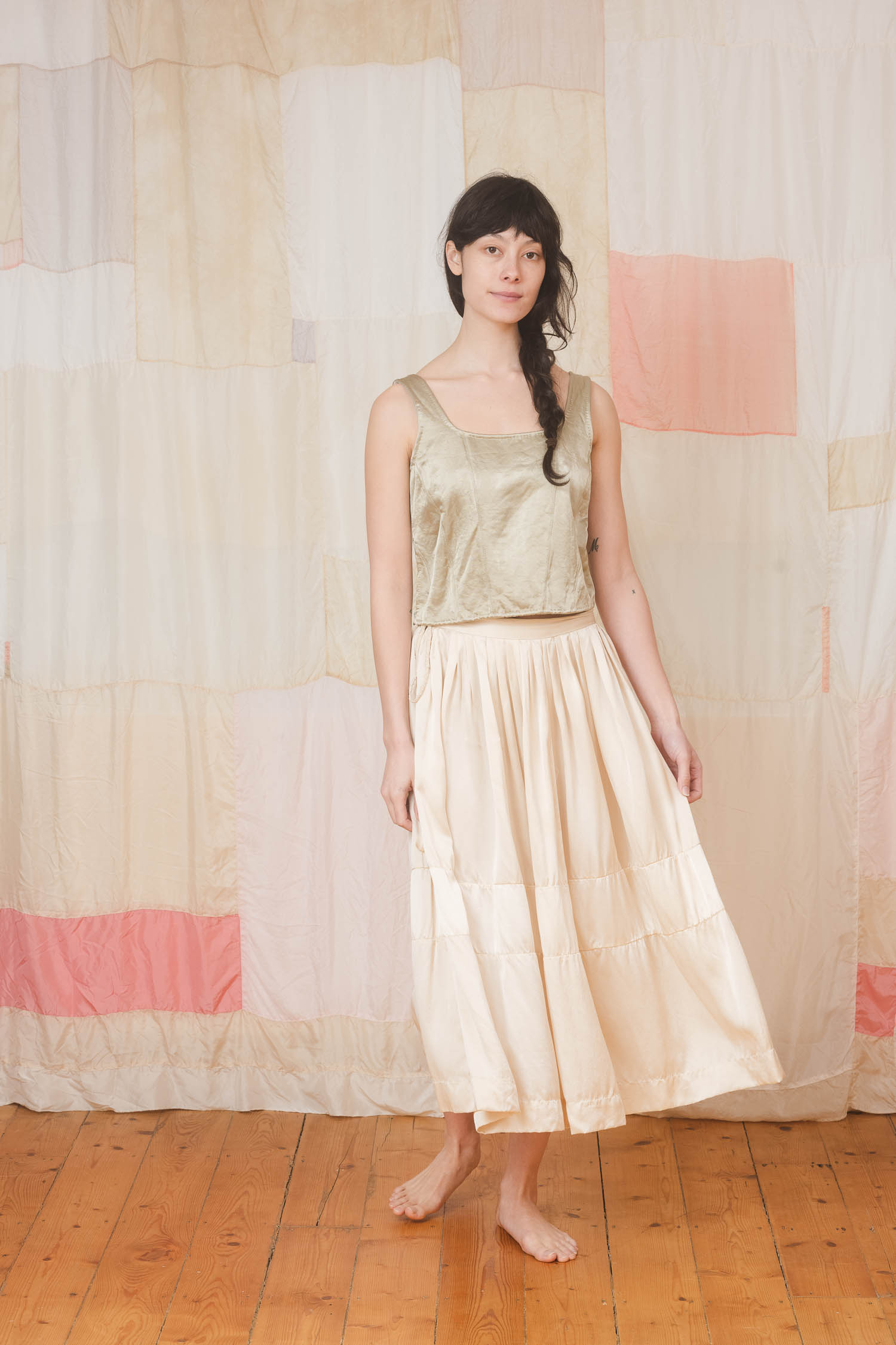 corset flight big skirt model wearing corset top sula Shiny panelled corset top and big satin skirt