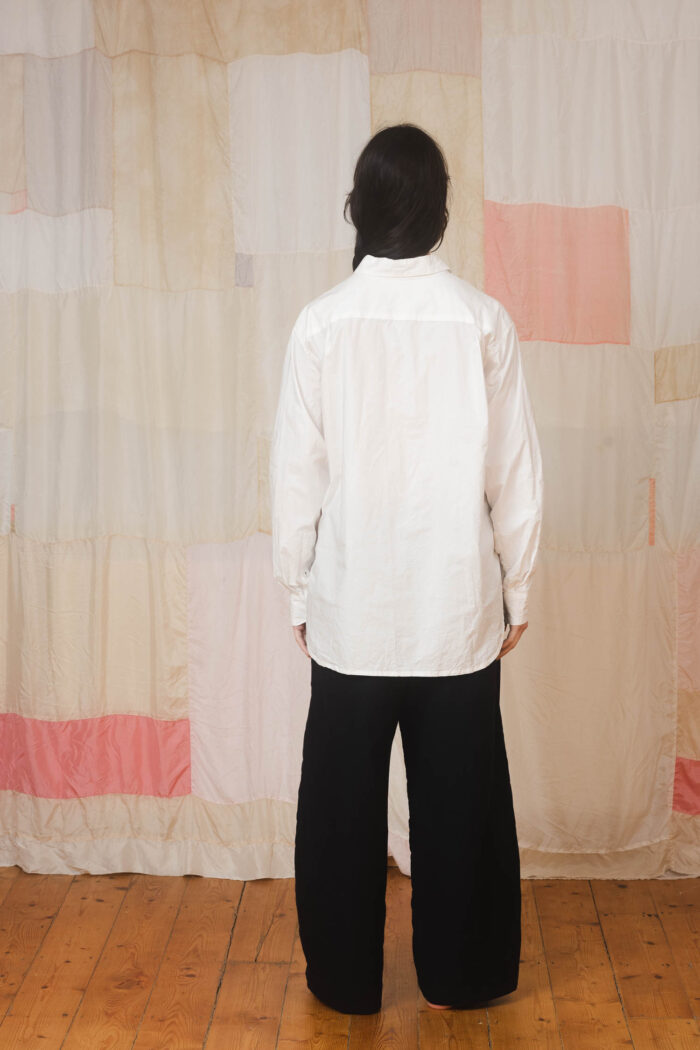 model wearing man shirt sula Cotton long sleeve shirt and tailored pants