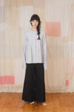 model wearing pleat shirt stripe sula Stripy shirt with pleats and mud pants