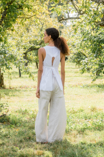 model wearing apron blouse