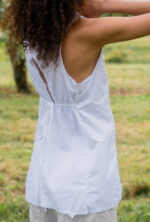 model wearing apron blouse