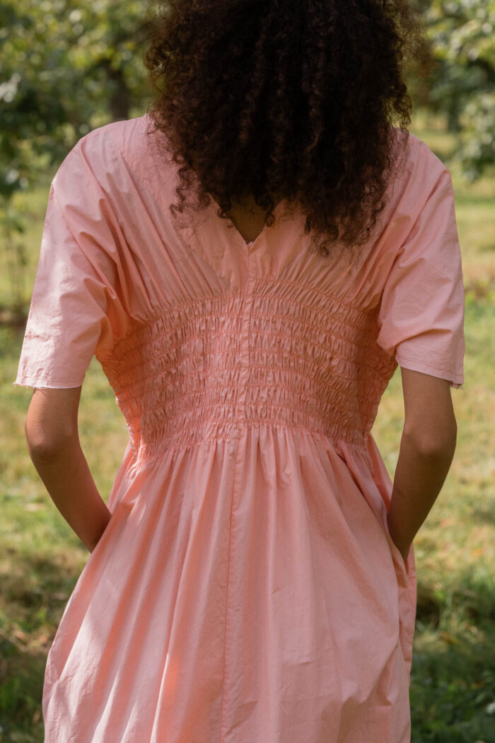 model wearing asymmetric moonbeam dress sula cotton gathered dress