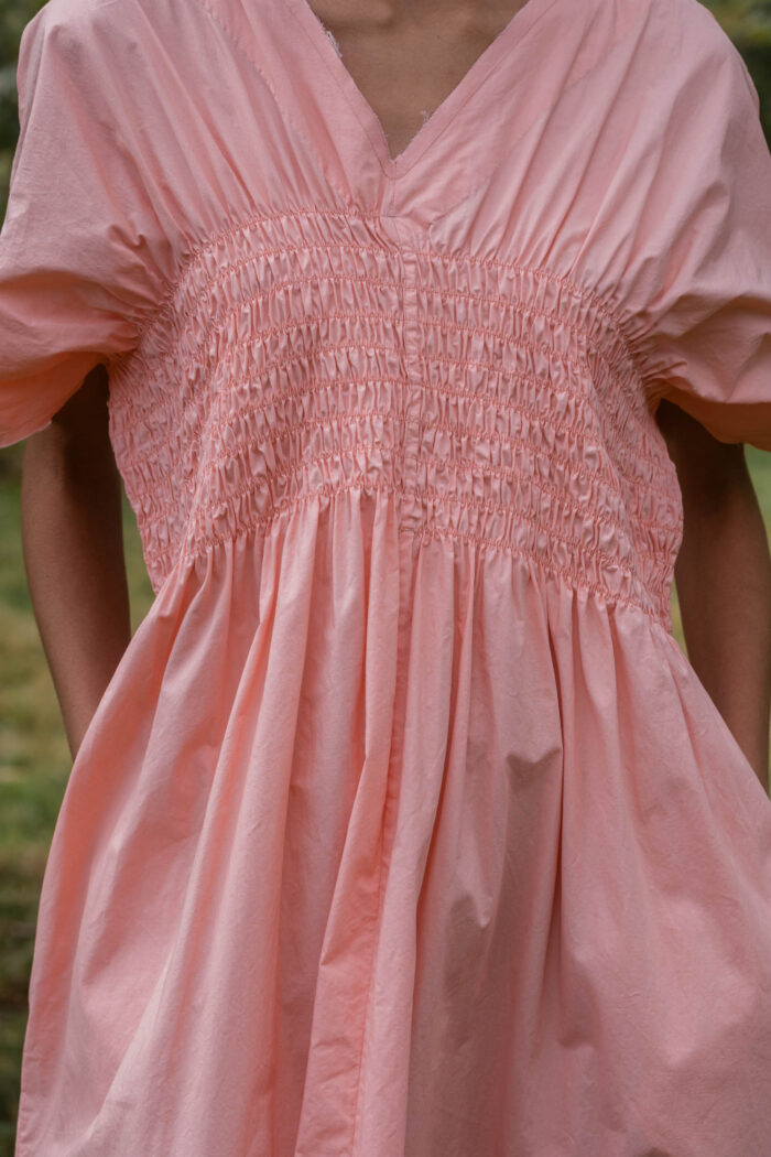 model wearing asymmetric moonbeam dress sula cotton gathered dress