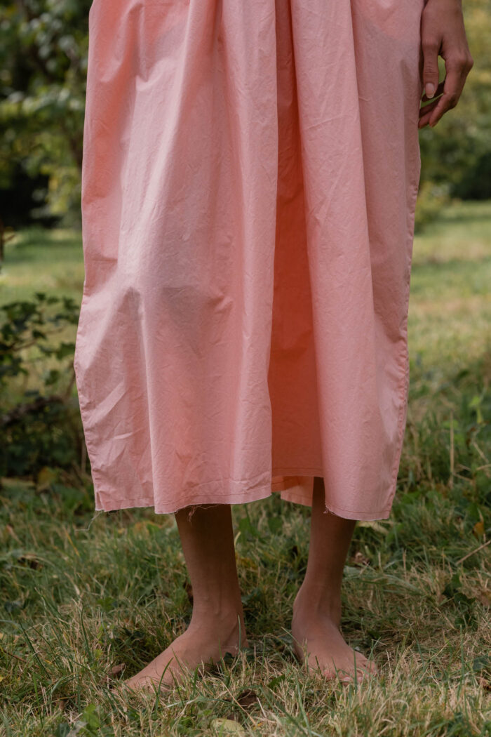 model wearing asymmetric moonbeam dress sula cotton gathered dress
