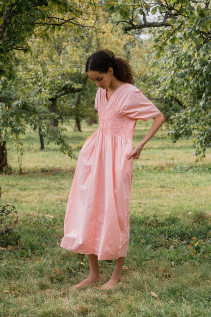 model wearing asymmetric moonbeam dress sula cotton gathered dress