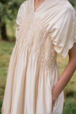 model wearing asymmetric moonbeam dress sula silk gathered dress