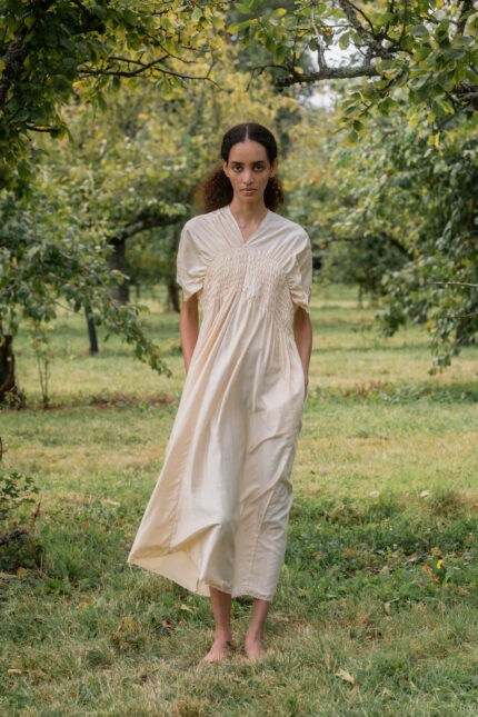 model wearing asymmetric moonbeam dress sula silk gathered dress