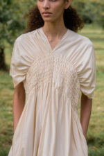 model wearing asymmetric moonbeam dress sula silk gathered dress