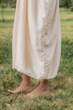 model wearing asymmetric moonbeam dress sula silk gathered dress