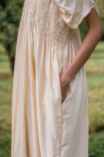 model wearing asymmetric moonbeam dress sula silk gathered dress