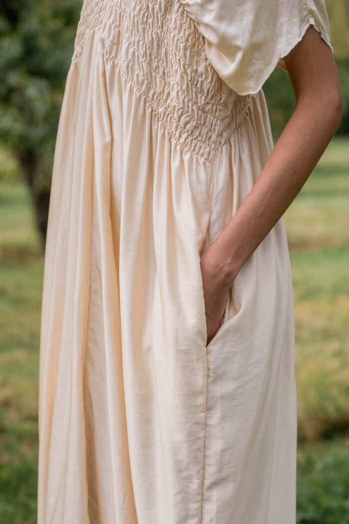 model wearing asymmetric moonbeam dress sula silk gathered dress