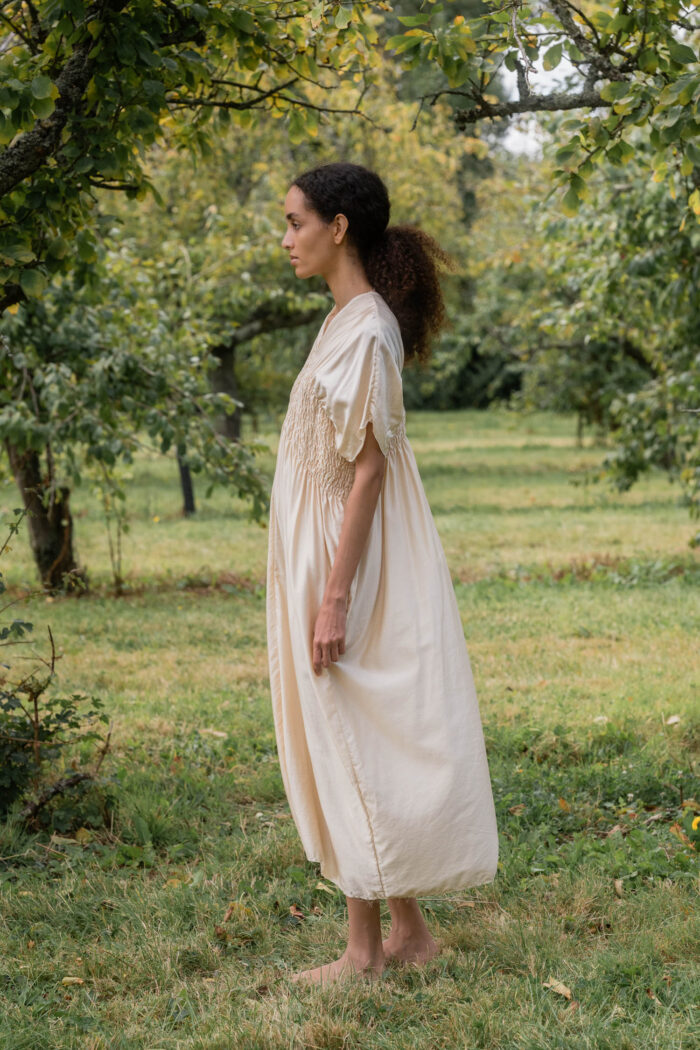 model wearing asymmetric moonbeam dress sula silk gathered dress
