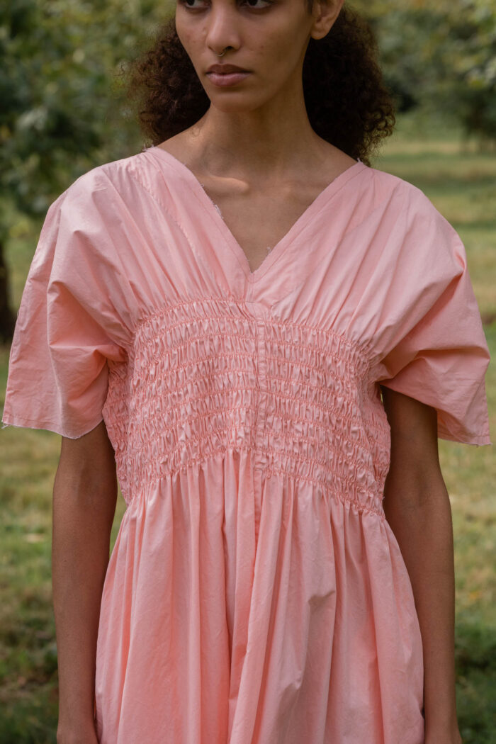 model wearing asymmetric moonbeam dress sula cotton gathered dress