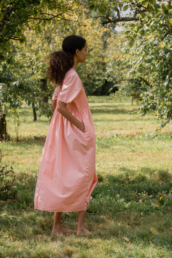 model wearing asymmetric moonbeam dress sula cotton gathered dress