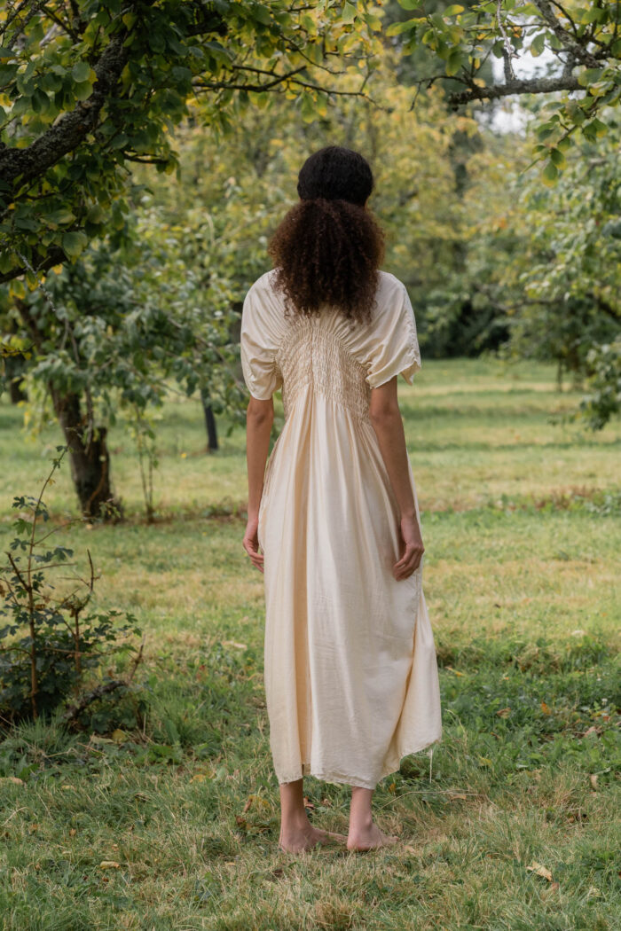 model wearing asymmetric moonbeam dress sula silk gathered dress