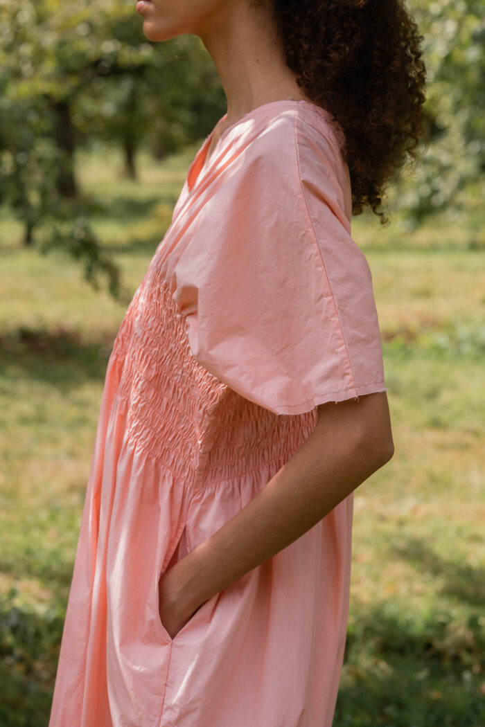 model wearing asymmetric moonbeam dress sula cotton gathered dress