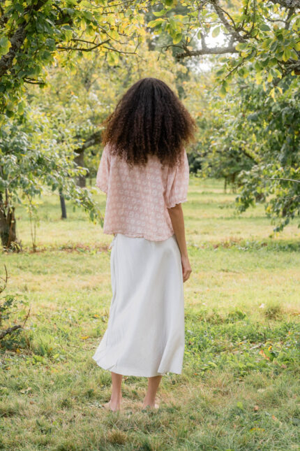 model wearing bias cut skirt short