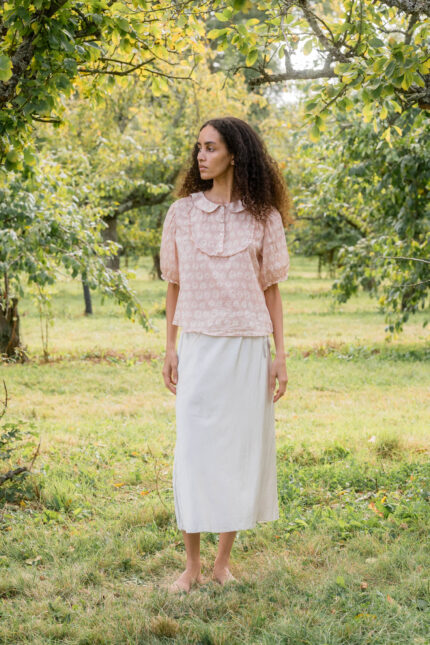 model wearing bias cut skirt short