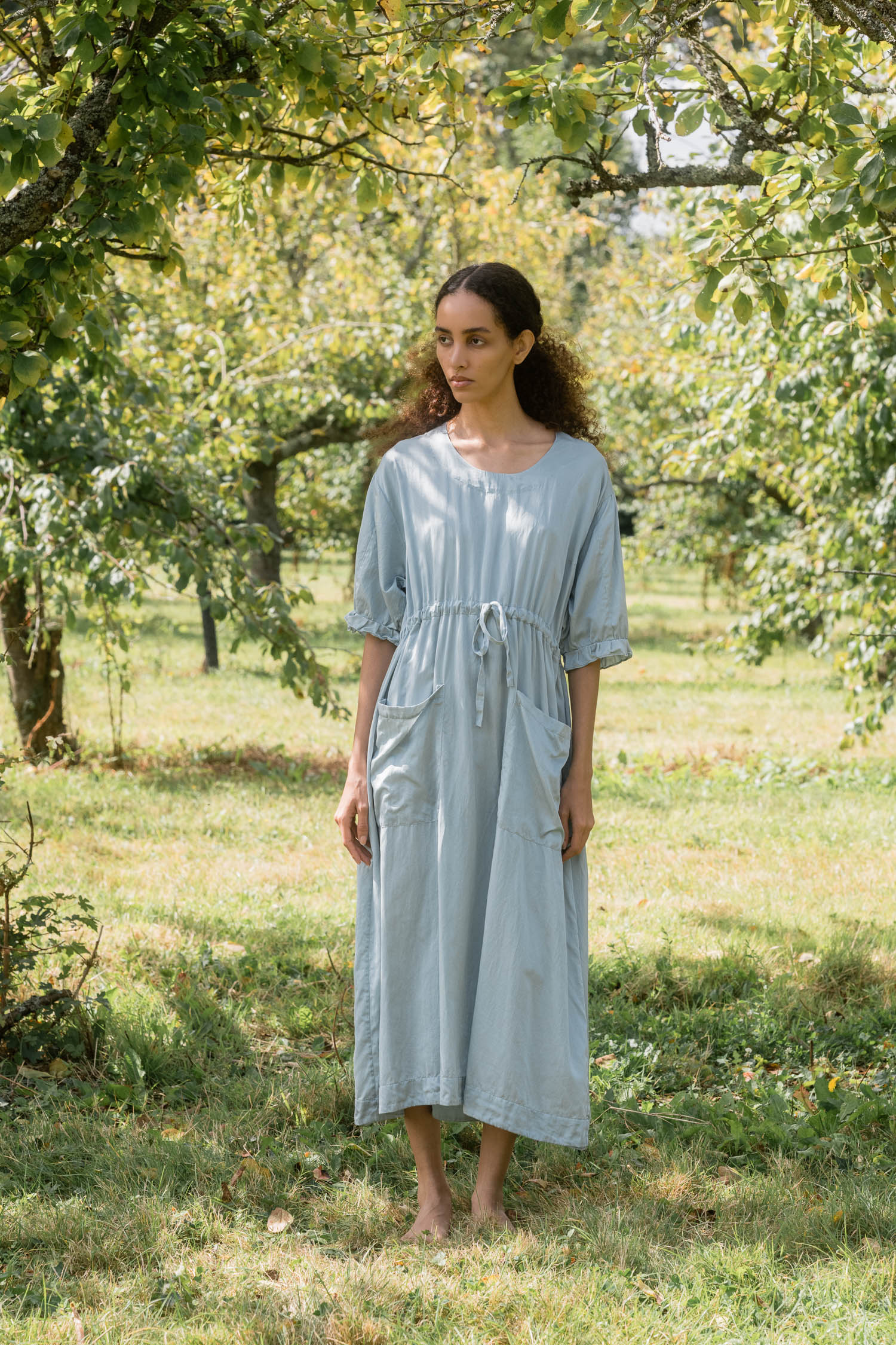 ss25 comfy pocket dress scs front model wearing comfy pocket dress scs sula silk drawstring dress