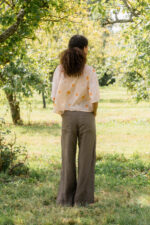 model wearing flare linen pants sula linen seventies trousers and clean new shirt print