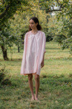 model wearing gathered dress tiny check sula oversize check dress