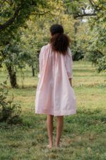 model wearing gathered dress tiny check sula oversize check dress