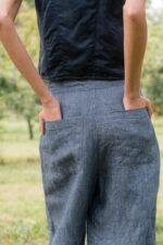 model wearing hem pants denim sula high waisted denim pants