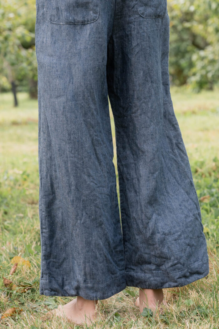 model wearing hem pants denim sula high waisted denim pants